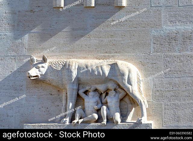 Relief of she-wolf suckling the mythical twin founders of Rome, Romulus and Remus on facade of building by the street Via della Conciliazione leading to the...