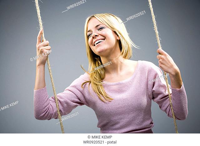 Woman on swing smiling