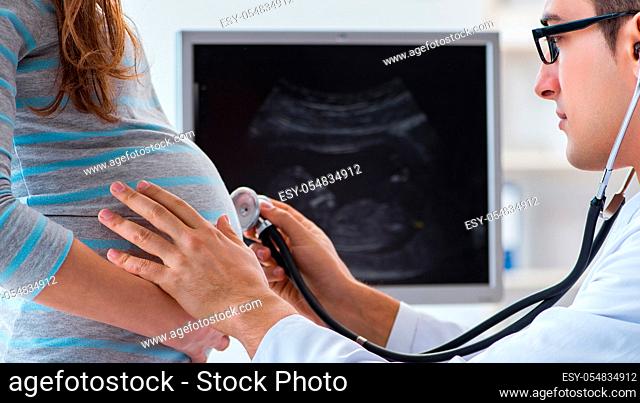The pregnant woman visiting doctor for regular check-up