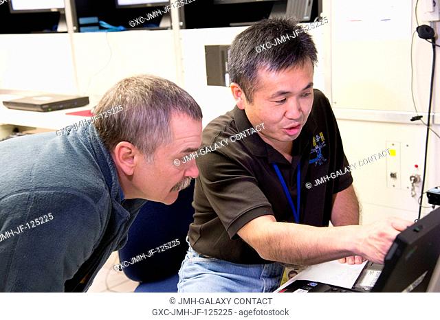 Japan Aerospace Exploration Agency (JAXA) astronaut Koichi Wakata (right), Expedition 38 flight engineer and Expedition 39 commander; and Russian cosmonaut...