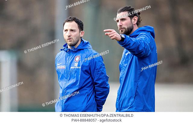 Domenico Tedesco (l), the new head coach of FC Erzgebirge Aue during the first training session of Bundesliga seconds team alongside co-trainer Robin Lenk in...