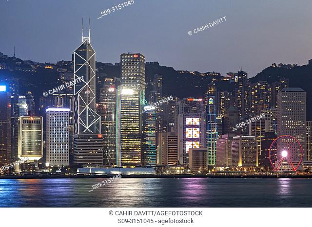 Skyscrapers on Hong Kong Island skyline with the Bank of China and Hong Kong Shanghai Bank at twilight seen from Tsim Sha Tsui, Kowloon, Hong Kong, S
