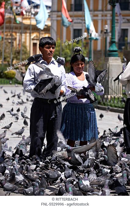 Locals psing with pigeons, Plaza Murillo, La Paz, Bolivia