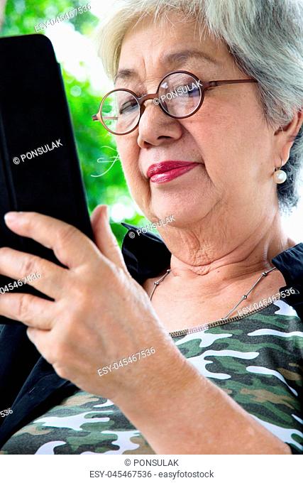 Senior woman with tablet