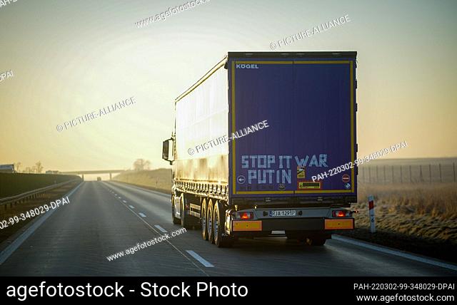 02 March 2022, Poland, Breslau: A truck with the inscription ""Stop it was Putin"" on its trailer drives across the A4 in Poland towards Wroclaw in the early...