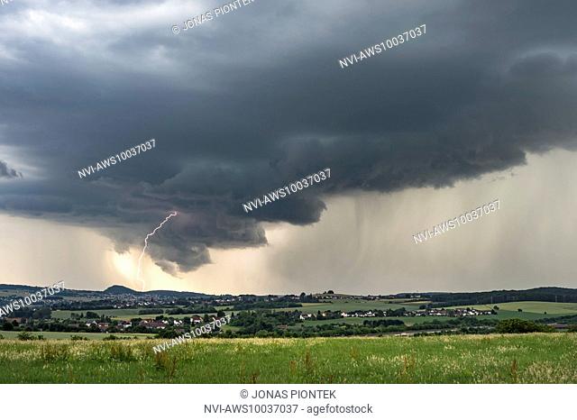 Cloud-to-ground lightning at wall cloud of a strong supercell near Saarlouis, Saarland, Germany
