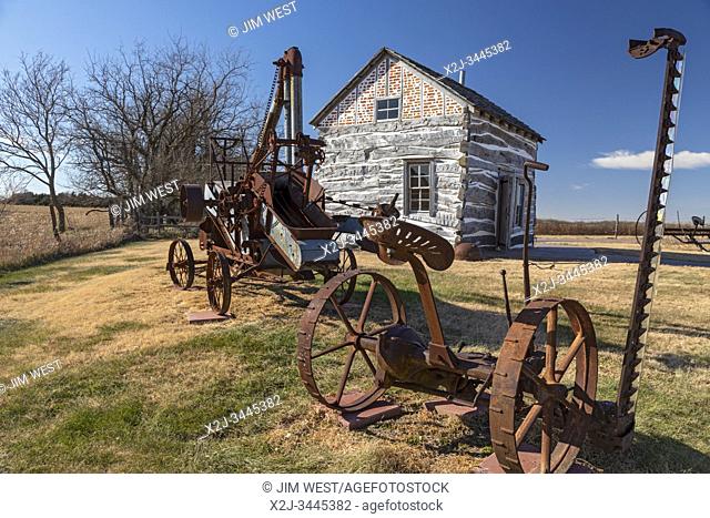 Beatrice, Nebraska - The Palmer-Epard Cabin at Homestead National Monument, with antique farm machinery