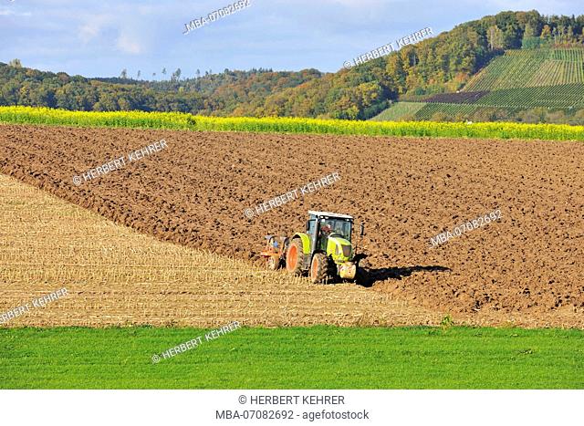 Tractor while ploughing a field