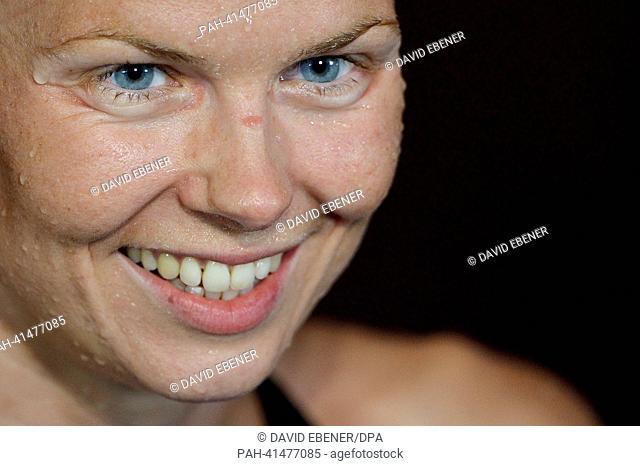 Britta Steffen of Germany amiles after the women's 100m Freestyle final during the 15th FINA Swimming World Championships at Palau Sant Jordi Arena in Barcelona