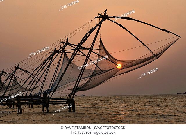Chinese fish nets at sunset in Fort Cochin (Kochi) in Kerala, India