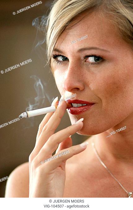 Portrait of a middle-aged woman smoking.  - SOLINGEN, GERMANY, 12/02/2005