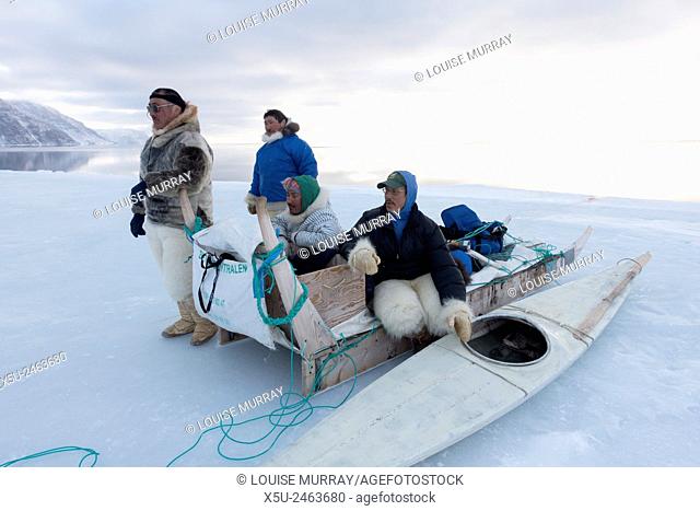 Group of Inuit or Inughiut hunters from Qaanaaq, greenland at the floe edge in Hvalsund,