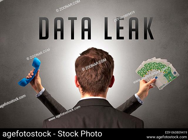 Rear view of a businessman with DATA LEAK inscription, cyber security concept