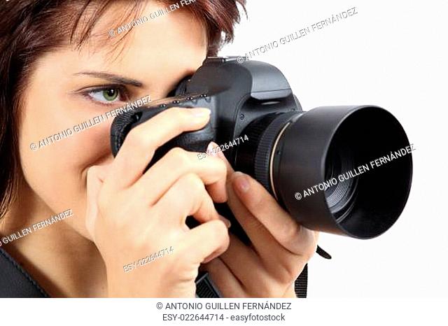 Beautiful photographer woman holding a digital camera
