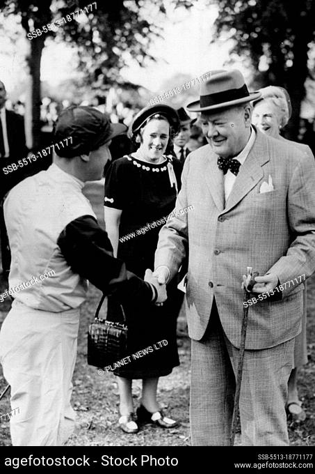 Winners Shake Hands- Windsor Eng: Winston Churchill Britian's war-time premier, with Mrs. Churchill, wishes Jockey T. Hawcroft the best of luck before riding...