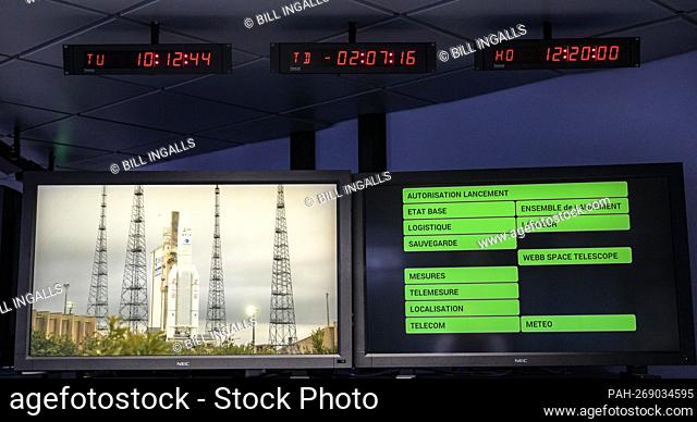 Monitors show the current status ahead of the launch of Arianespace's Ariane 5 rocket carrying NASA’s James Webb Space Telescope, Saturday, Dec