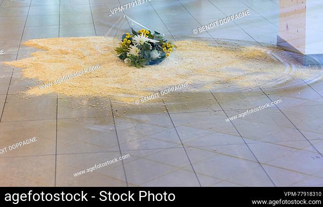 Illustration picture shows flowers on the floor where a victim was yesterday on the site of Monday's attack, the entrance to an office building, in Brussel