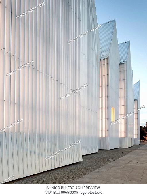 Dusk perspective of luminous exterior facade. Szczecin Philharmonic Hall, Szczecin, Poland. Architect: Estudio Barozzi Veiga, 2014