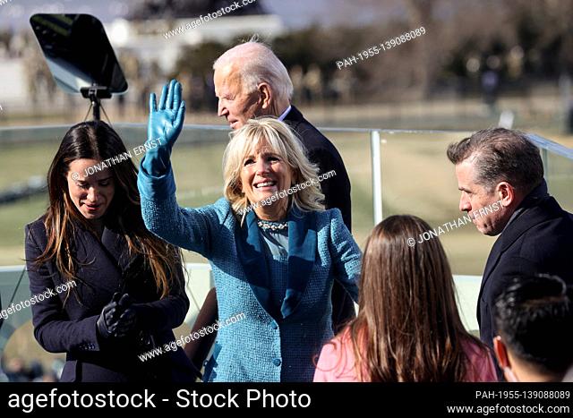 Jill Biden waves next to Ashley and Hunter Biden after her husband Joe was sworn-in as the 46th President of the United States during the inauguration on the...