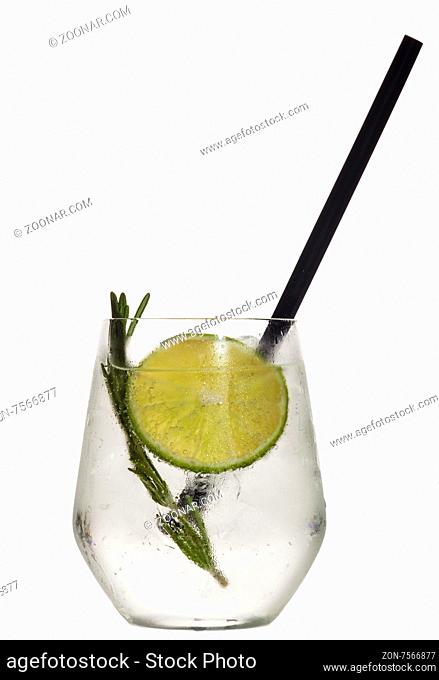 Glass with alcoholic drink with lime and ice isolated on white background