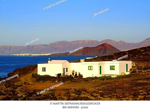 Residential house in volcanic landscape, Tenesar, near Tinajo, Montana Bermeja, Club La Santa, back Risco de Famara, Lanzarote, Canary Islands, Spain