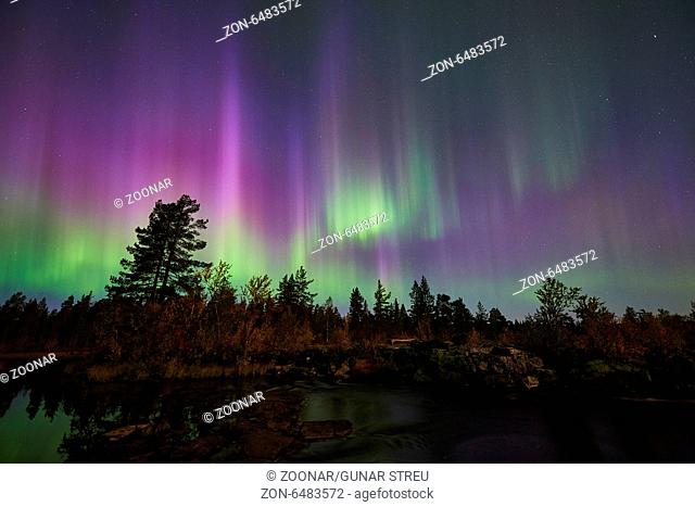 Northern lights above a creek, Lapland, Sweden