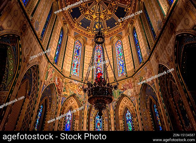 KILKENNY, IRELAND, DECEMBER 23, 2018: Magnificent interior of St. Mary's Cathedral with walls, stained glasses and roof decorated with biblical themes