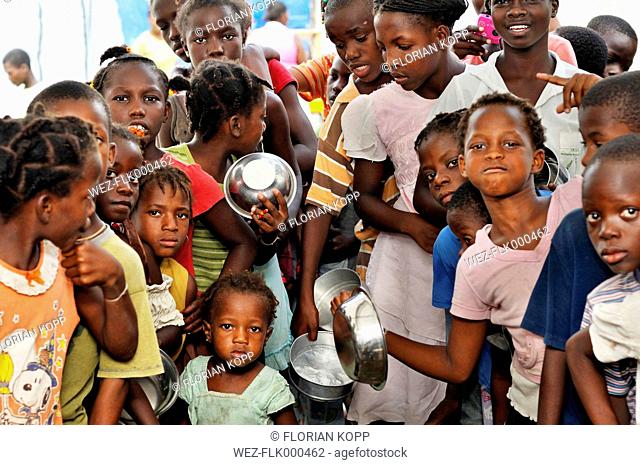 Haiti, Port-au-Prince, Camp for earthquake victims in Croix-de--Bouquet, Children waiting at the food bank