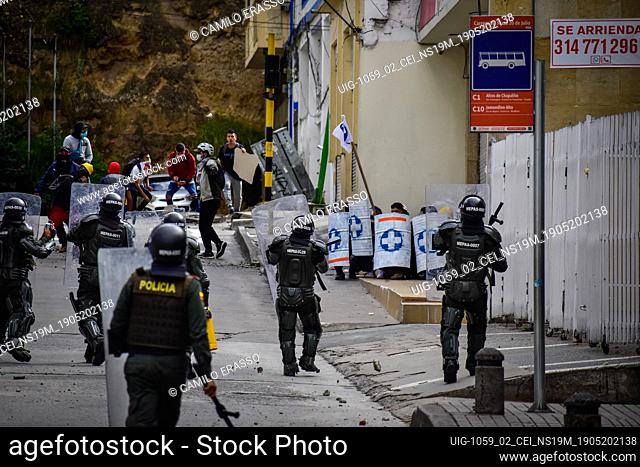 Riot police try to disband demostrators with tear gas and stunt granades in Pasto, Narino on May 19, 2021 during an antigovernment protest against police...