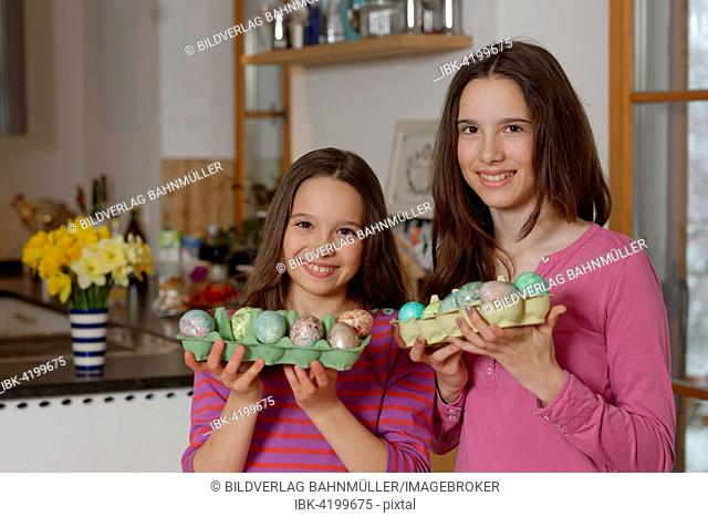 Girls with coloured Easter eggs for the Easter basket, Easter, Upper Bavaria, Bavaria, Germany