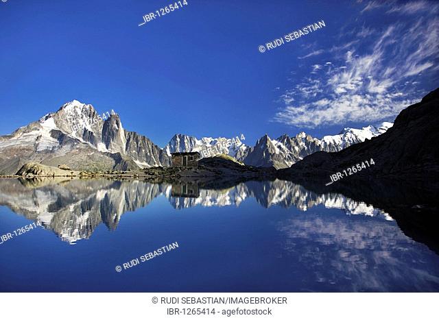 The Aiguilles de Chamonix mountains reflected in Lac Blanc lake, far right Mont Blanc, Haute-Savoie, France, Europe
