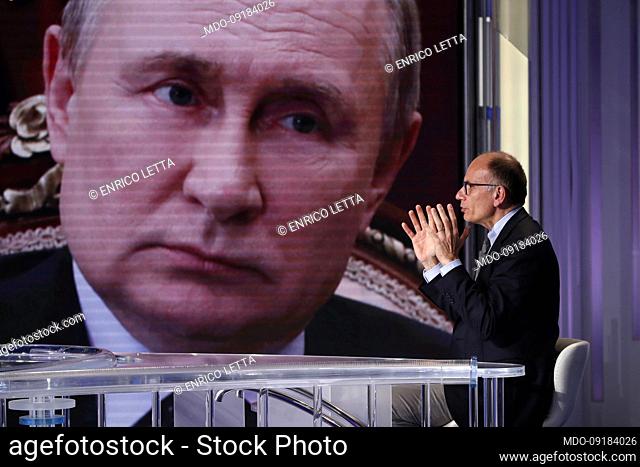 Italian secretary of the Democratic party Enrico Letta guest at the tv broadcast Porta a Porta. On the screen, Russian President Vladimir Putin