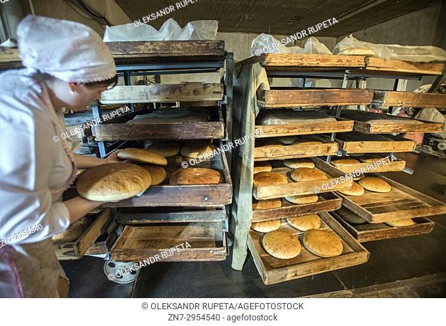 Workers of the Nikitin Kolkhoz bakery prepare bread, Ivanovka village, Azerbaijan. Bakery makes bread for local people. Children from school and kindergarden of...