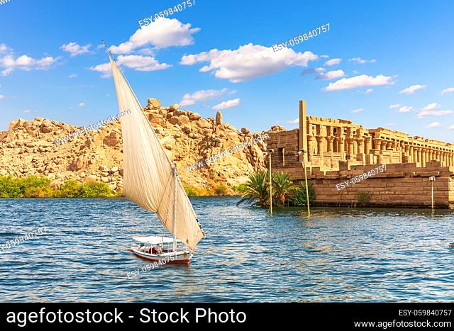 Felucca by the Temple of Philae on the Agilikia island, the Nile, Aswan, Egypt