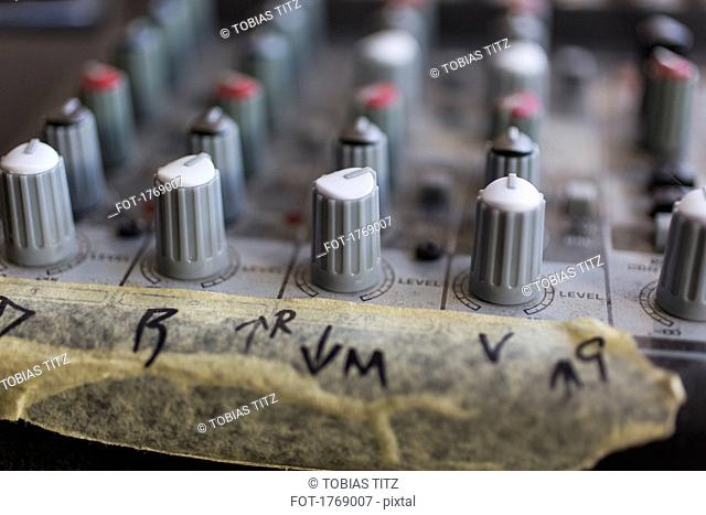 Close up sound mixer dials with taped markings
