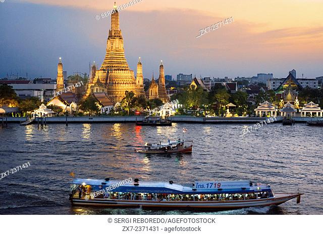 Landscape in sunset of Wat Arun Temple from Chao Praya River from the roof of Sala Rattanakosin Hotel. Bangkok. Thailand. Asia