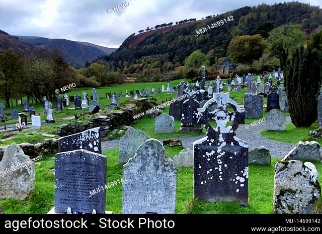 Medieval stone cross of the Glendalough monastery in the Wicklow mountains in Ireland