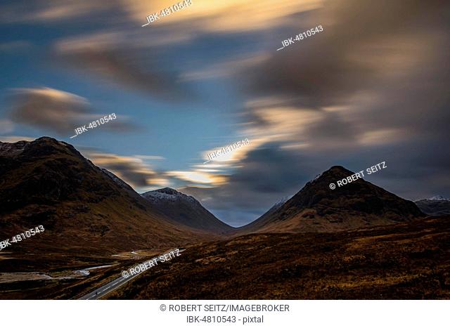 Road with summit of Stob Coire and Stob Na Doire in the background, Glen Coe, west Highlands, Scotland, United Kingdom