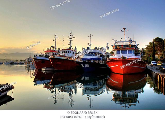 Fishing boats on early morning on calm sea