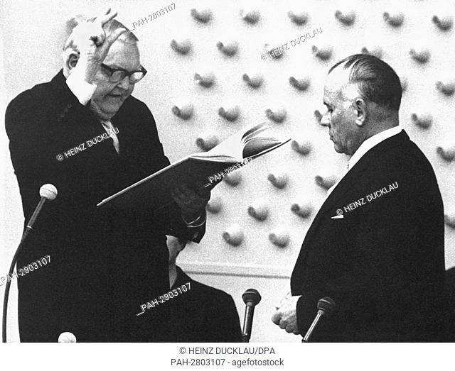 German chancellor Ludwig Erhard (l) is officially sworn in by the president of the Bundestag Eugen Gerstenmaier (r) in front of the plenum of the German...