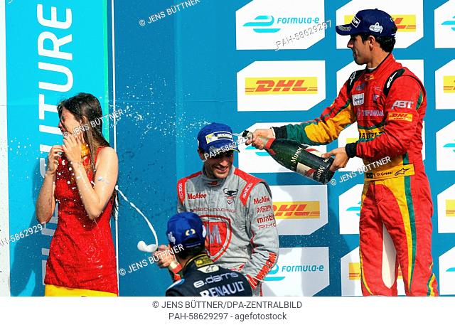 Lucas di Grassi (Brazil, R) from Team Audi Sport sprays champagne after victory at the FIA Formula E race on the former Tempelhof airfield in Berlin,  Germany