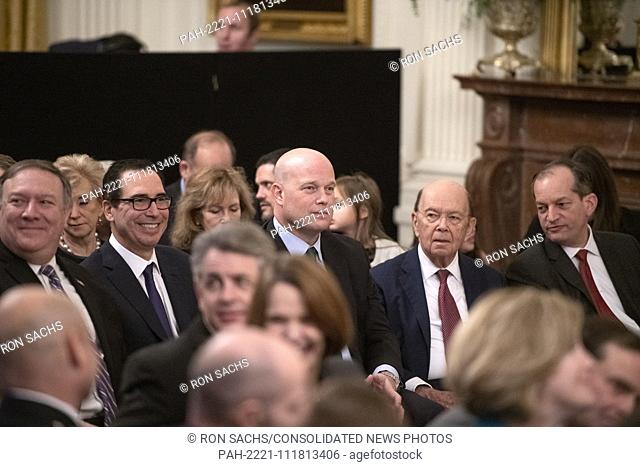 Acting Attorney General Matthew G. Whitaker, center, sits with members of the President's cabinet as they await the arrival of US President Donald J