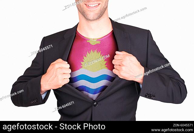 Businessman opening suit to reveal shirt with flag, Kiribati