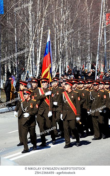 Students cadets dressed in the form of various types of troops of the Red Army at the celebration of the Victory in the city of Nizhnevartovsk