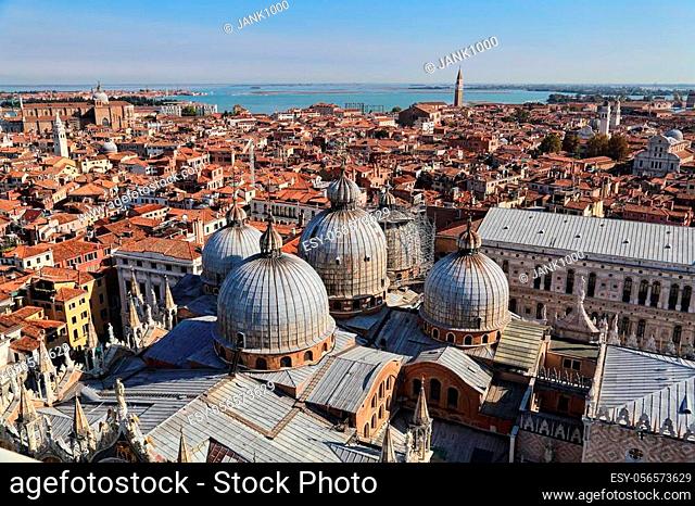 Domes of San Marco Basilica and cityscape of Venice and the sea beyond, Italy