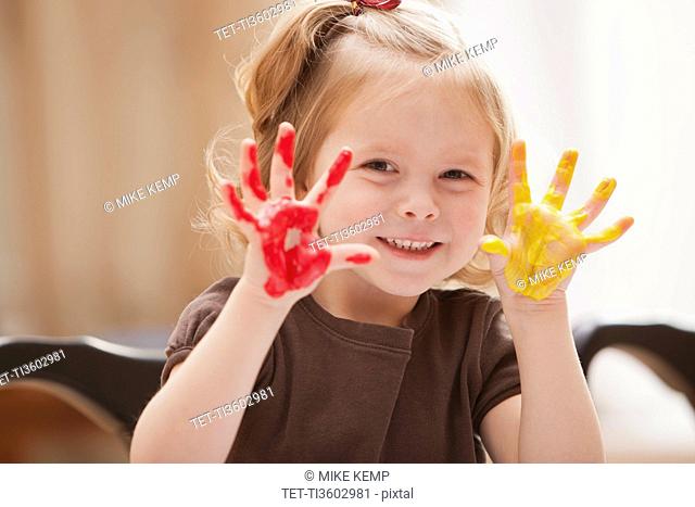 Girl 2-3 with paint covered hands