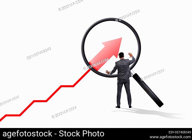Concept of the economic growth with chart and magnifying glass
