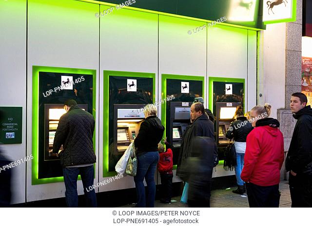 Customers using Lloyds Bank ATM machines after dark