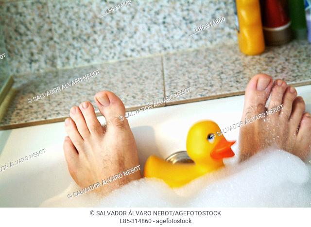 Adult rubber ducky in the bathtub