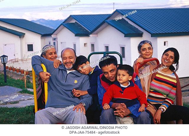 Urban Indian Family of seven on holiday at Koti near Simla , Himachal Pradesh , India , model released